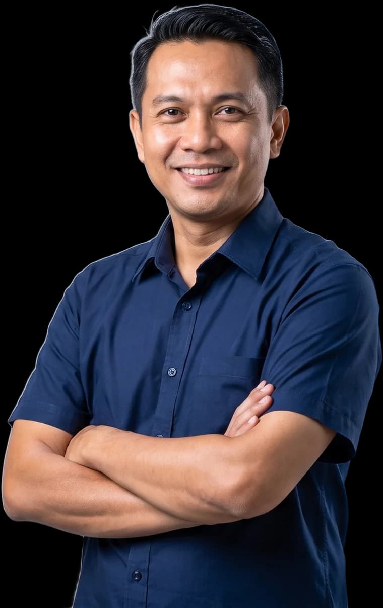 An experienced Malaysian tradesman standing with his arms folded
